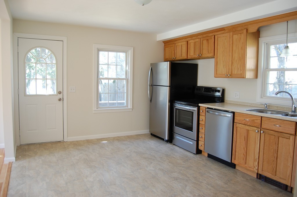 139 Valley Road Barre, MA 01005 - Photo 5 of 15 a kitchen with stainless steel appliances kitchen island granite countertop a stove a sink dishwasher and a refrigerator