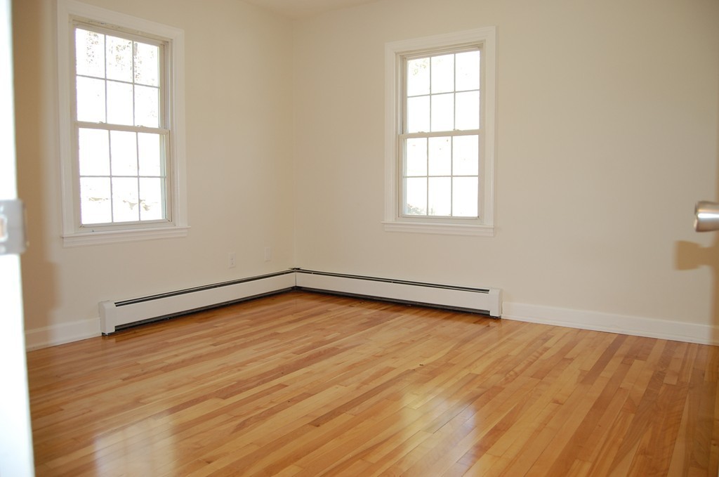 139 Valley Road Barre, MA 01005 - Photo 7 of 15 an empty room with wooden floor and windows