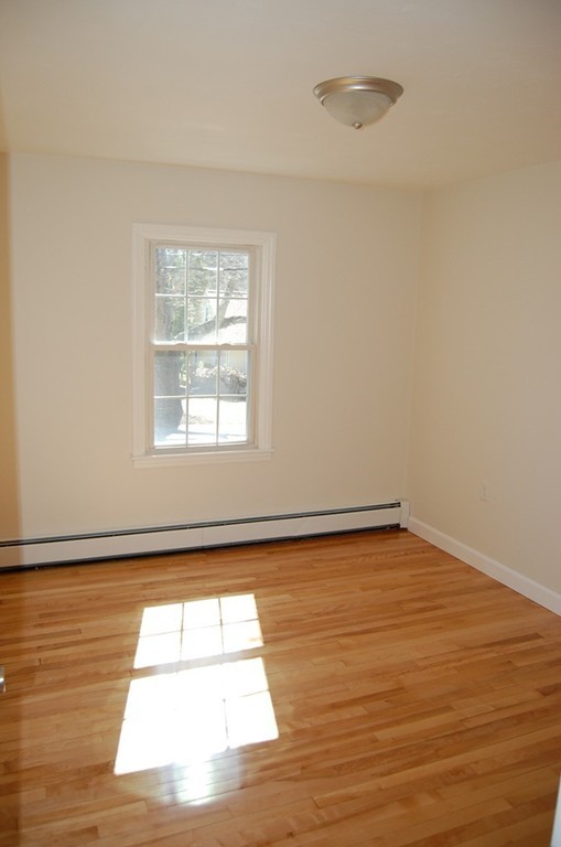 139 Valley Road Barre, MA 01005 - Photo 8 of 15 a view of empty room with wooden floor and fan