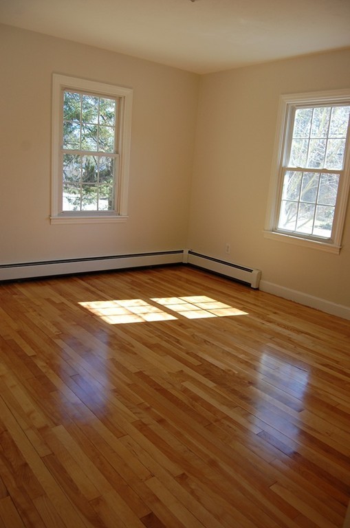 139 Valley Road Barre, MA 01005 - Photo 9 of 15 a view of empty room with wooden floor and fan