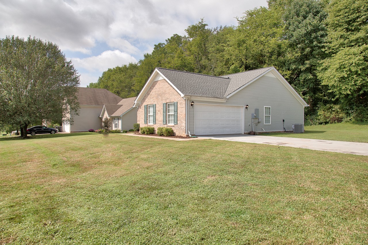 1879 Portway Road Spring Hill, TN 37174 - Photo 2 of 17 a view of a house with a yard