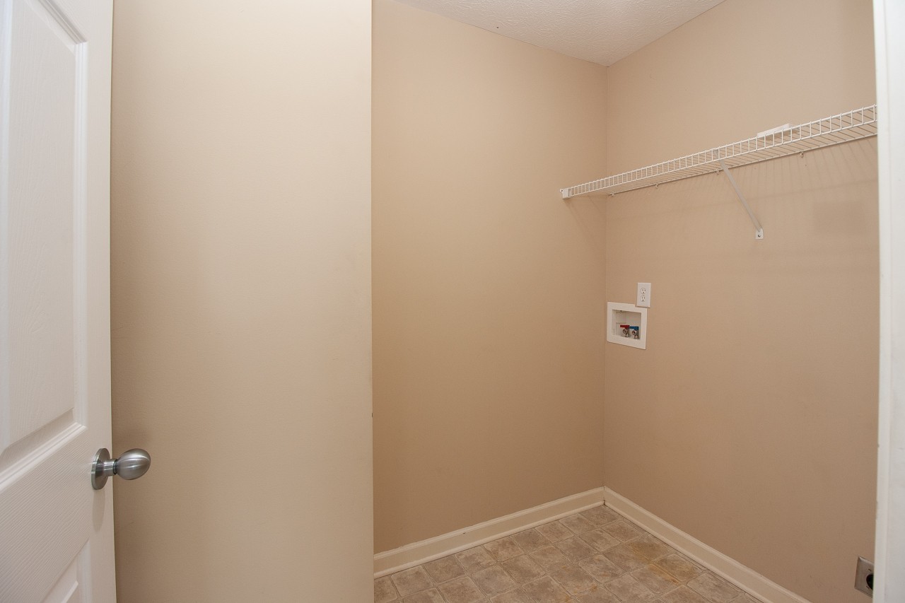 1879 Portway Road Spring Hill, TN 37174 - Photo 4 of 17 a view of a room with rack on the wall