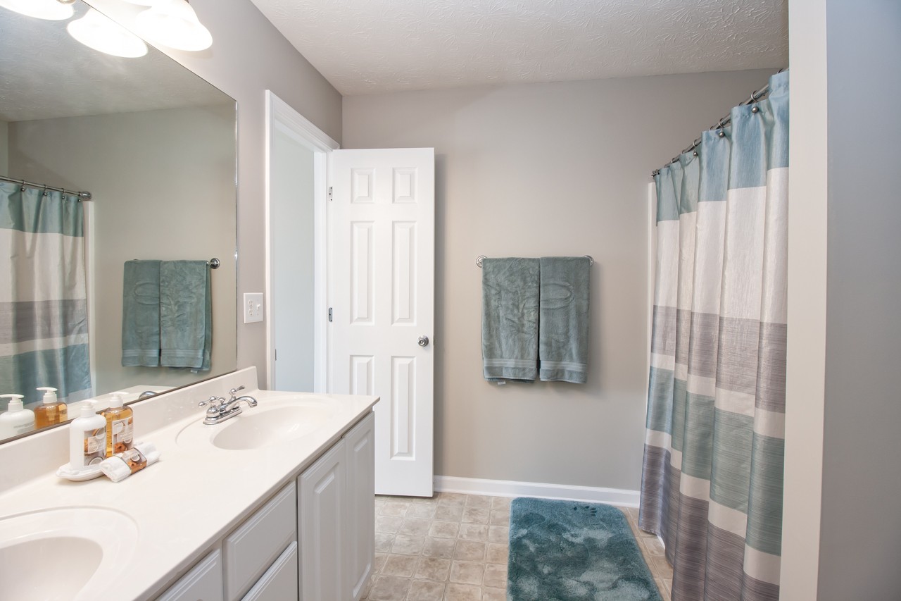1879 Portway Road Spring Hill, TN 37174 - Photo 8 of 17 a bathroom with a sink and a mirror