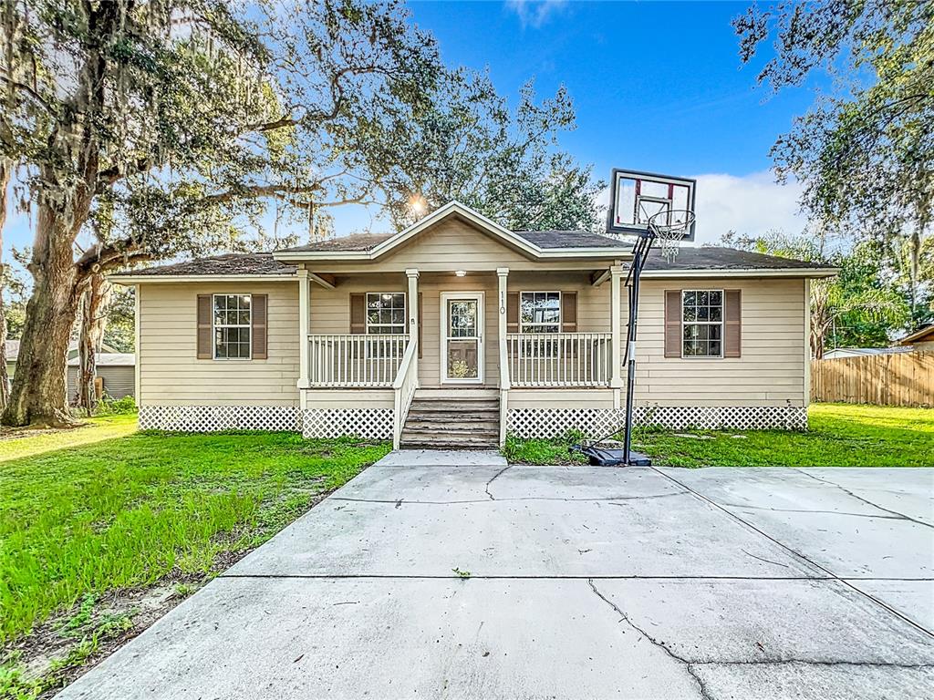 110 Berry Road Winter Haven, FL 33880 - Photo 1 of 1 a front view of a house with garden