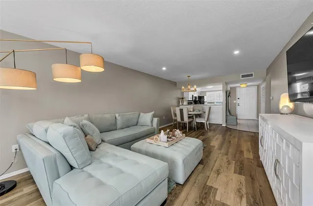 a kitchen with a sink and a stove top oven