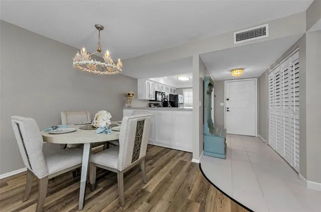 a bedroom with a large bed and a large window