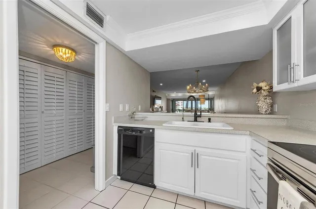 a bathroom with a granite countertop sink a toilet a mirror and shower