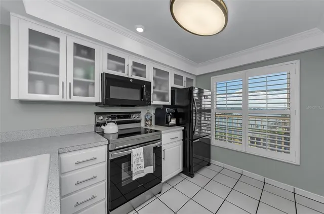a view of a balcony dining area with furniture