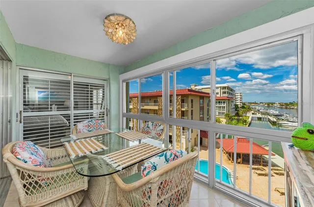 a view of swimming pool with outdoor seating