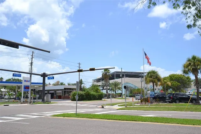 a swimming pool with outdoor seating and lake view
