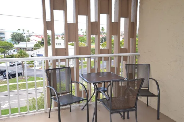 a view of a swimming pool with outdoor seating