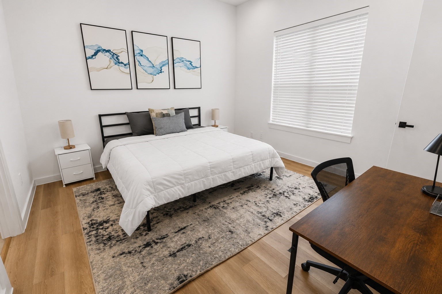 6742 Peerless Street, Unit B Houston, TX 77021 - Photo 15 of 32 Rest and recharge in a spacious primary retreat featuring tall ceilings, abundant natural light, and room for a king sized bed plus a dedicated work or reading nook. Neutral finishes, oversized windows, and a thoughtfully designed layout create a calm and inviting space to start and end each day.
