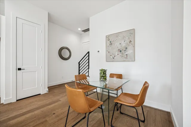 a view of a room with furniture and wooden floor