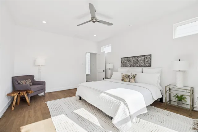 a bedroom with a bed and a chair