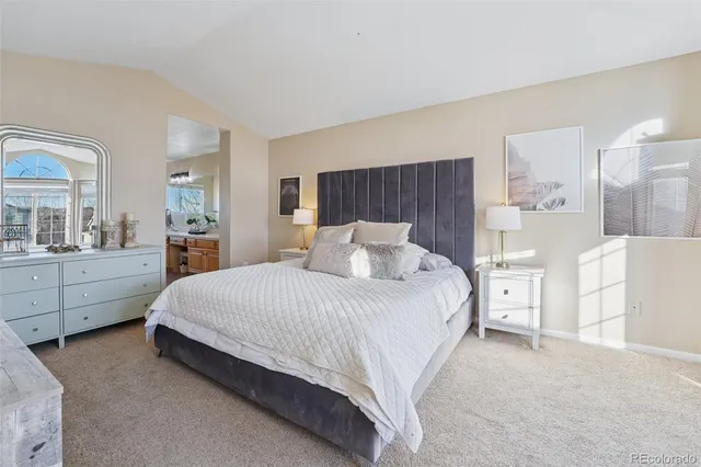 a spacious bedroom with a bed and window