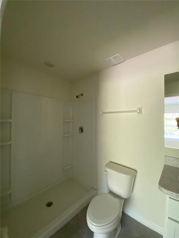 492 Hickory Course Loop Ocala, FL 34472 - Photo 22 of 28 a white toilet sitting next to a shower