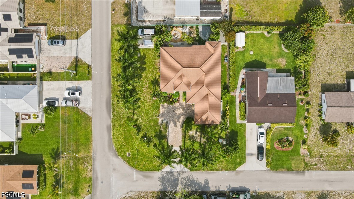 1700 43rd Terrace Southwest Naples, FL 34116 - Photo 38 of 38 an aerial view of a residential apartment building with a yard and plants