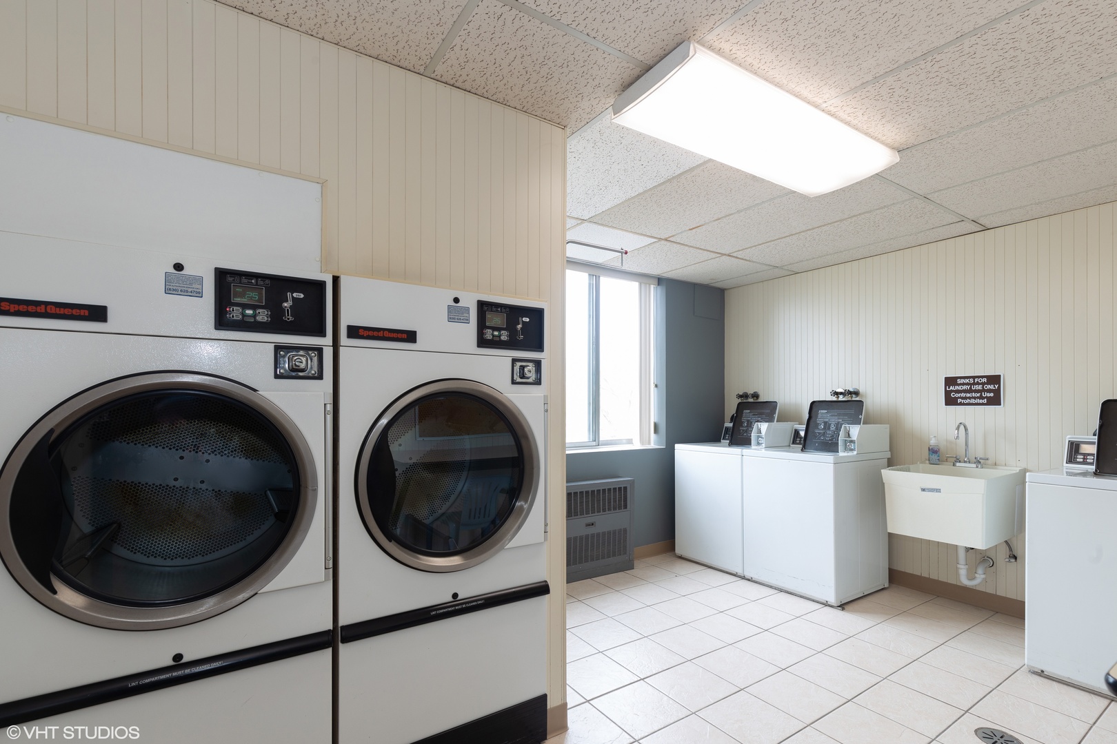 100 West Butterfield Road, Unit 512N Elmhurst, IL 60126 - Photo 15 of 16 a utility room with dryer washer and a view of living room