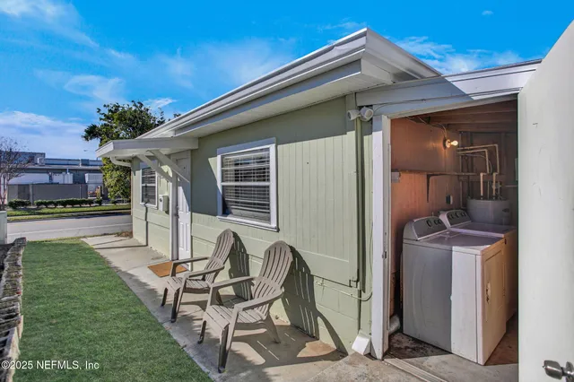 a view of a patio with a yard