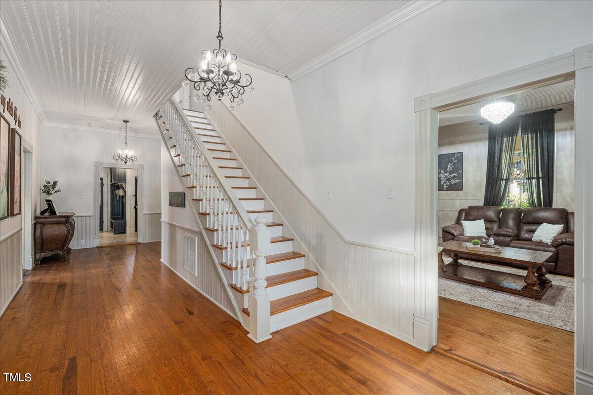 26 Oak Street Roxboro, NC 27573 - Photo 11 of 56 a view of a livingroom with furniture and staircase