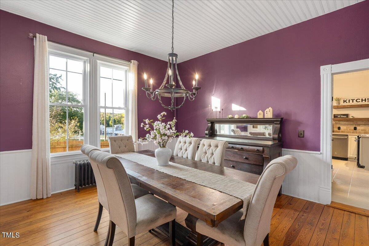26 Oak Street Roxboro, NC 27573 - Photo 18 of 56 a view of a dining room with furniture window and wooden floor