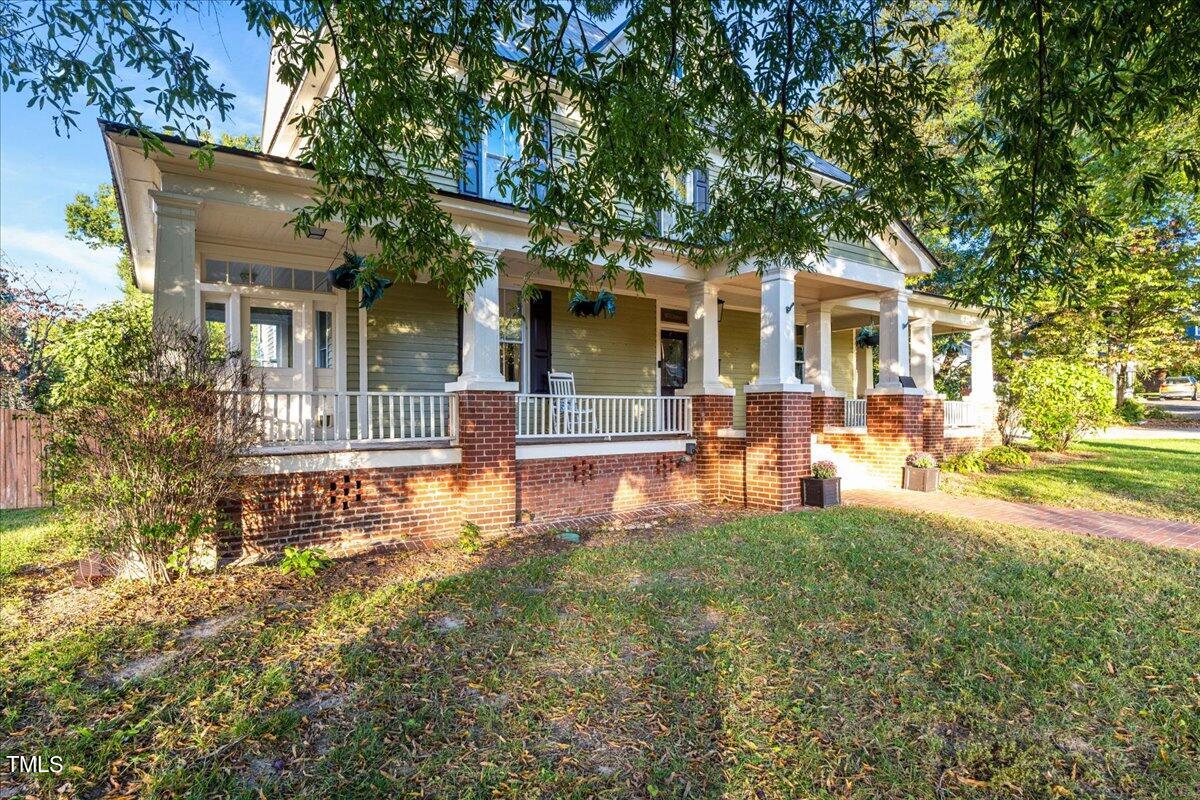 26 Oak Street Roxboro, NC 27573 - Photo 4 of 56 front view of a house with a yard