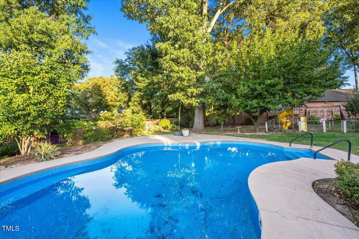 26 Oak Street Roxboro, NC 27573 - Photo 44 of 56 a view of swimming pool with seating space and garden