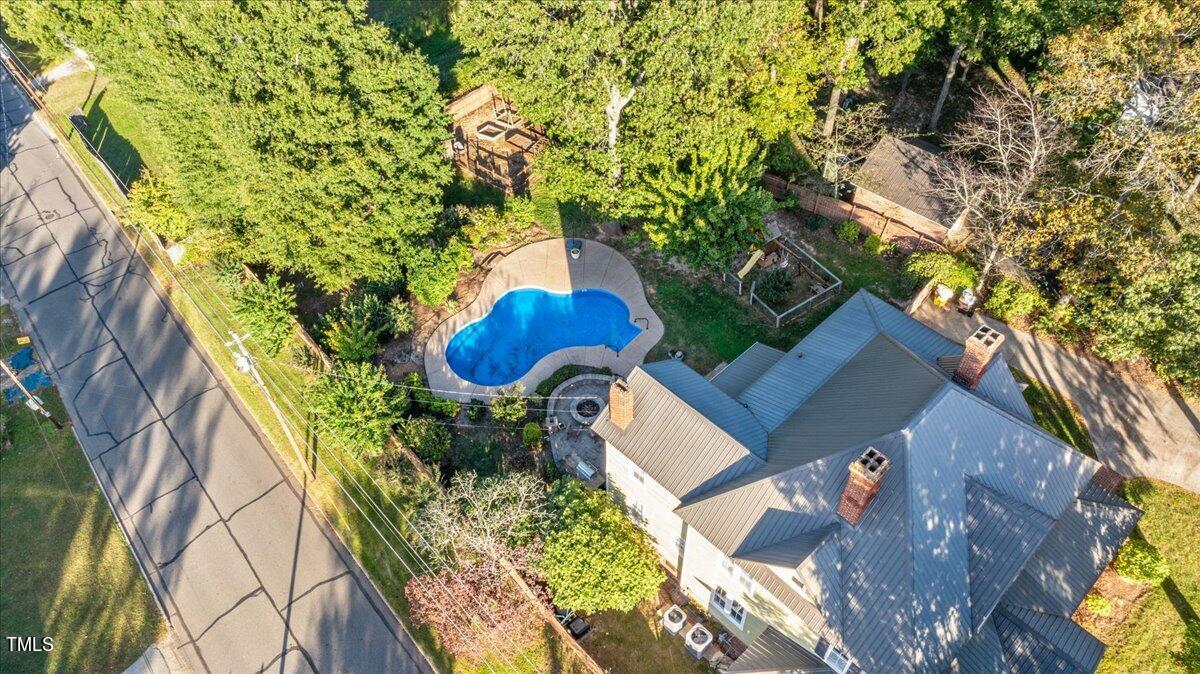26 Oak Street Roxboro, NC 27573 - Photo 7 of 56 an aerial view of a house with swimming pool and large trees