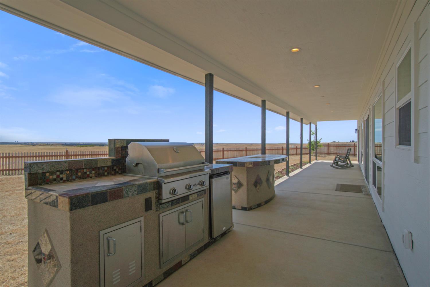 7991 South Shingle Road Shingle Springs, CA 95682 - Photo 45 of 58 a kitchen with a stove a sink and a refrigerator