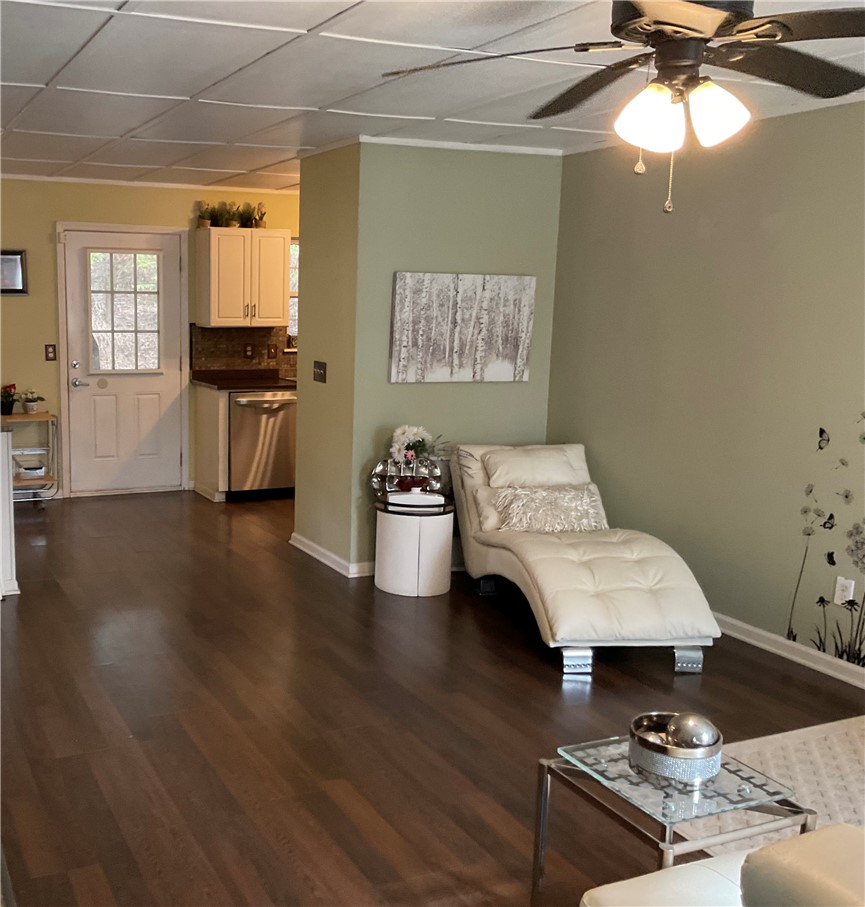 229 Cub Cove Drive Walhalla, SC 29691 - Photo 22 of 50 This inviting space features rich hardwood flooring and an open-concept design connecting to the kitchen.