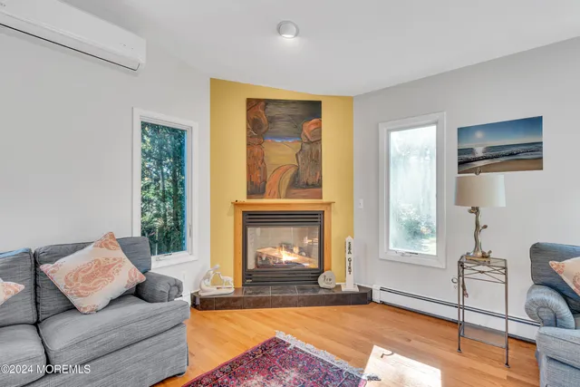 a white toilet sitting next to a bath tub