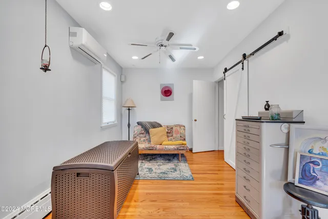 a living room with furniture and a lamp