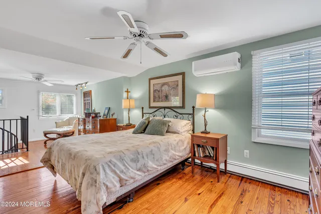 a view of a backyard with furniture and garden