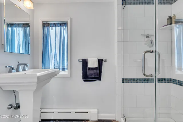 a view of a patio with table and chairs and potted plants