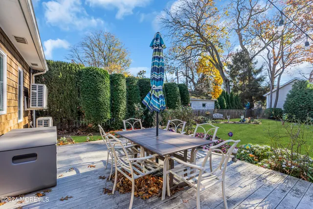 a view of a house with brick walls