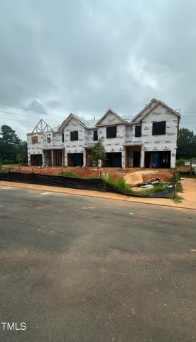 a view of multiple houses with a street