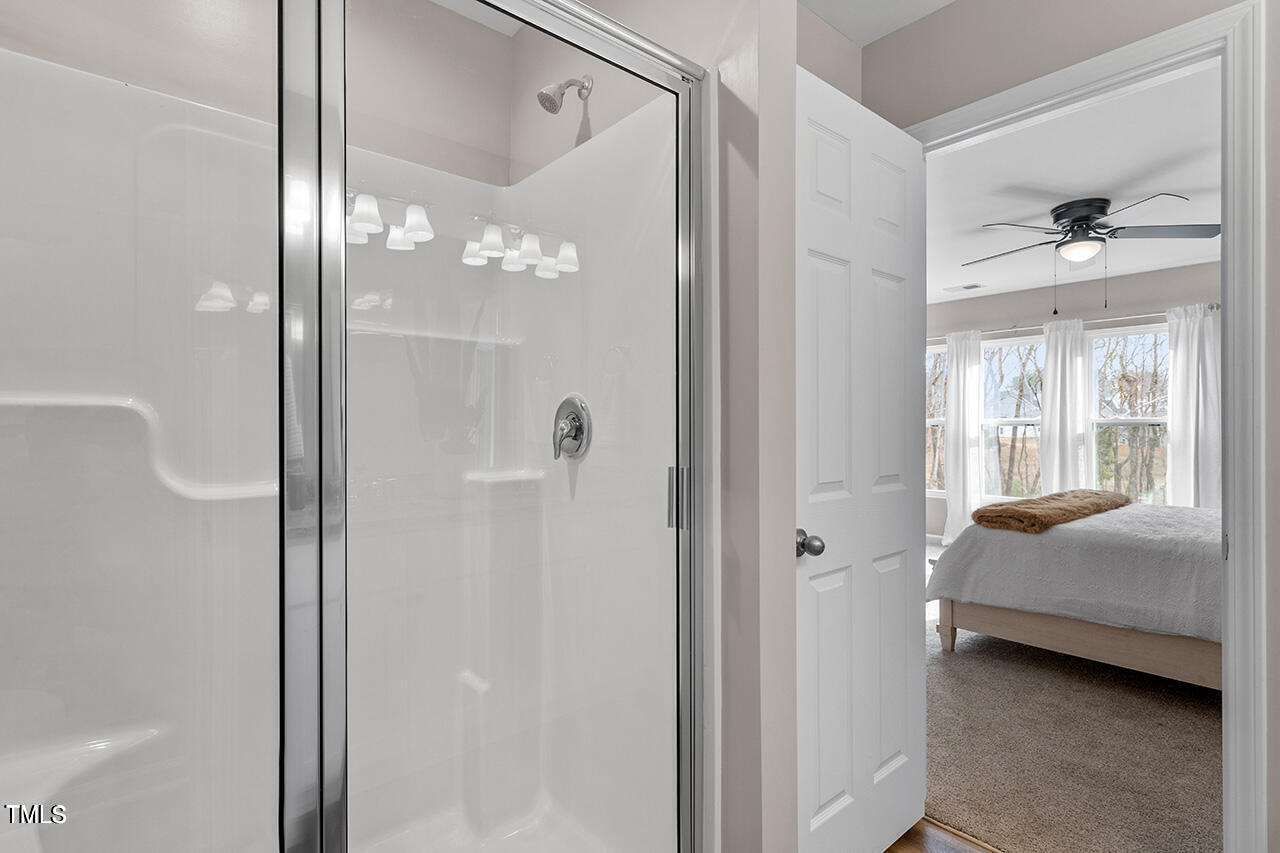 874 John Street Clayton, NC 27520 - Photo 21 of 25 a en suite bathroom with a shower and a sink