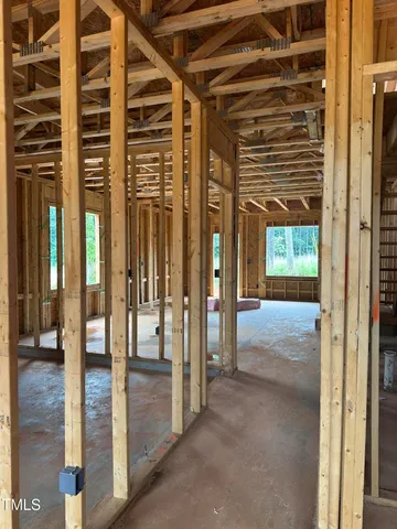 a view of a room with wooden floor and windows