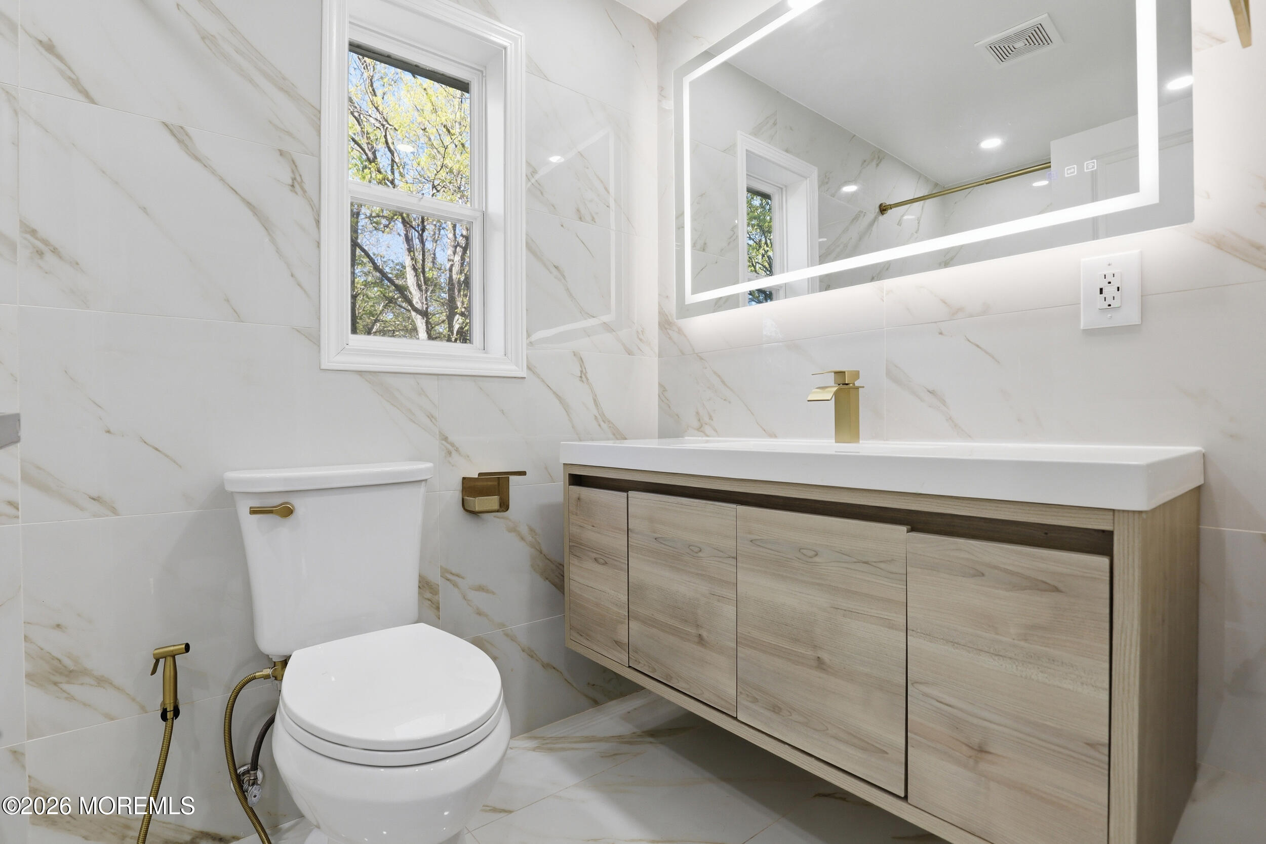 492 Cobain Road Jackson, NJ 08527 - Photo 30 of 47 a bathroom with a toilet sink and mirror