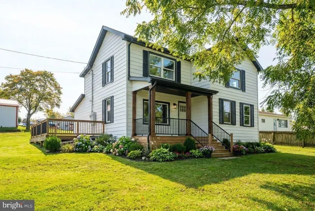 a kitchen with stainless steel appliances a stove microwave and refrigerator