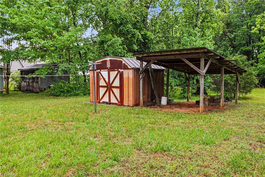 626 Kenneth Road Greensboro, NC 27455 - Photo 32 of 34 Outdoor storage building for tools and toys!
