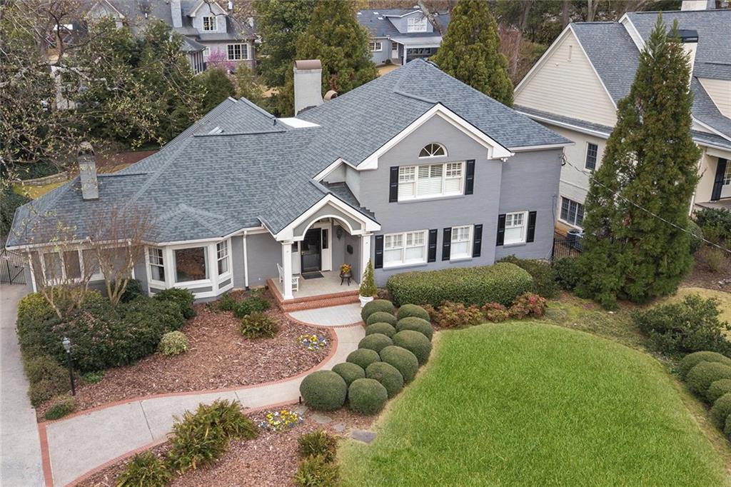 250 Robin Hood Road Northeast Atlanta, GA 30309 - Photo 1 of 1 a front view of a house with a yard
