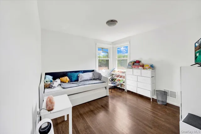a bathroom with a sink a toilet a mirror and shower