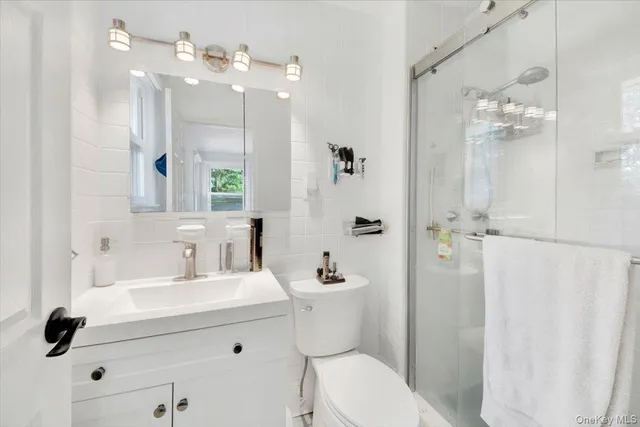 a bed room with a bed and a window