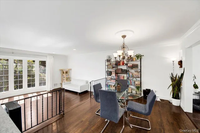 a view of a dining room with furniture and window