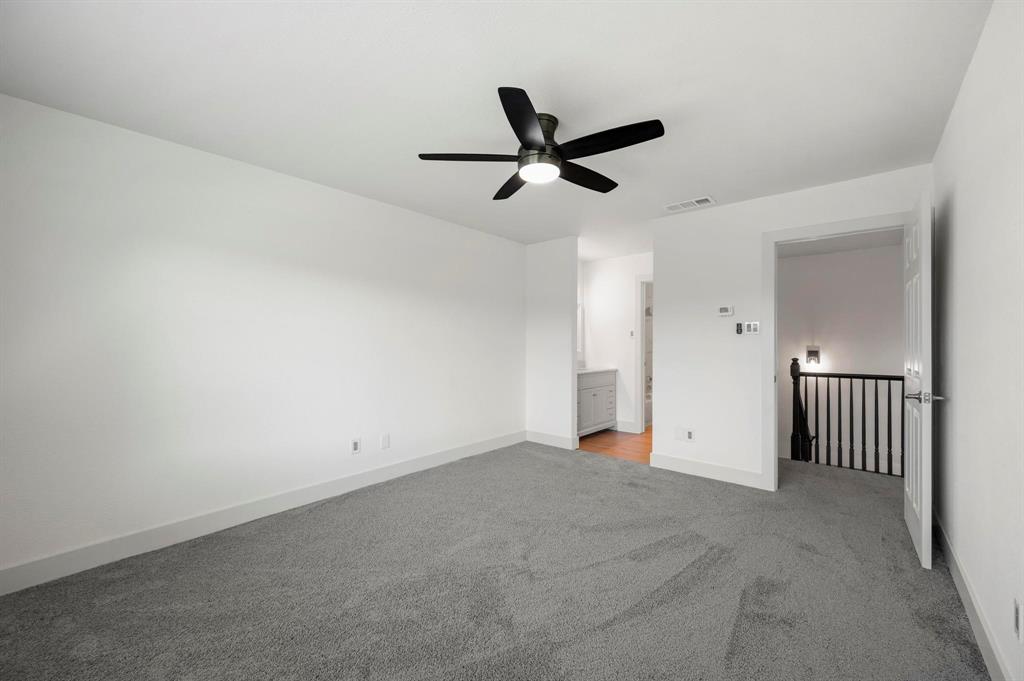 4247 Madera Road Irving, TX 75038 - Photo 20 of 28 an empty room with a ceiling fan and window