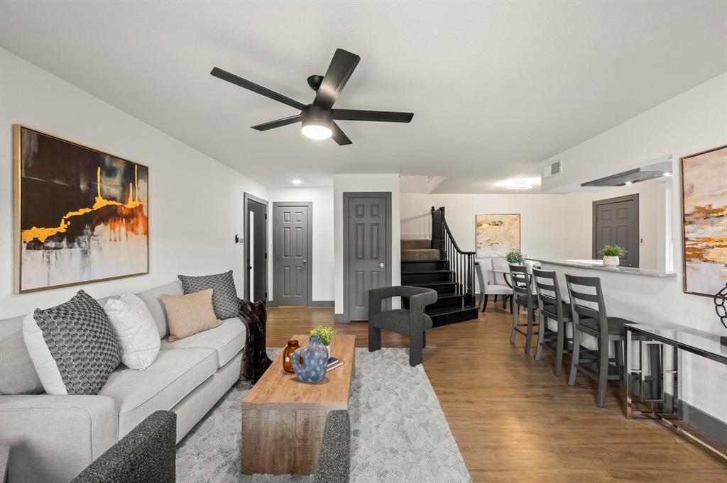 4247 Madera Road Irving, TX 75038 - Photo 3 of 28 a living room with furniture kitchen view and a wooden floor