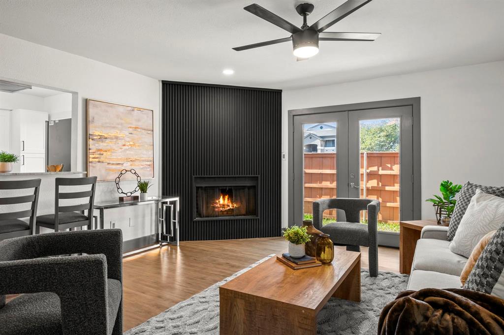 4247 Madera Road Irving, TX 75038 - Photo 5 of 28 a living room with furniture and a fireplace