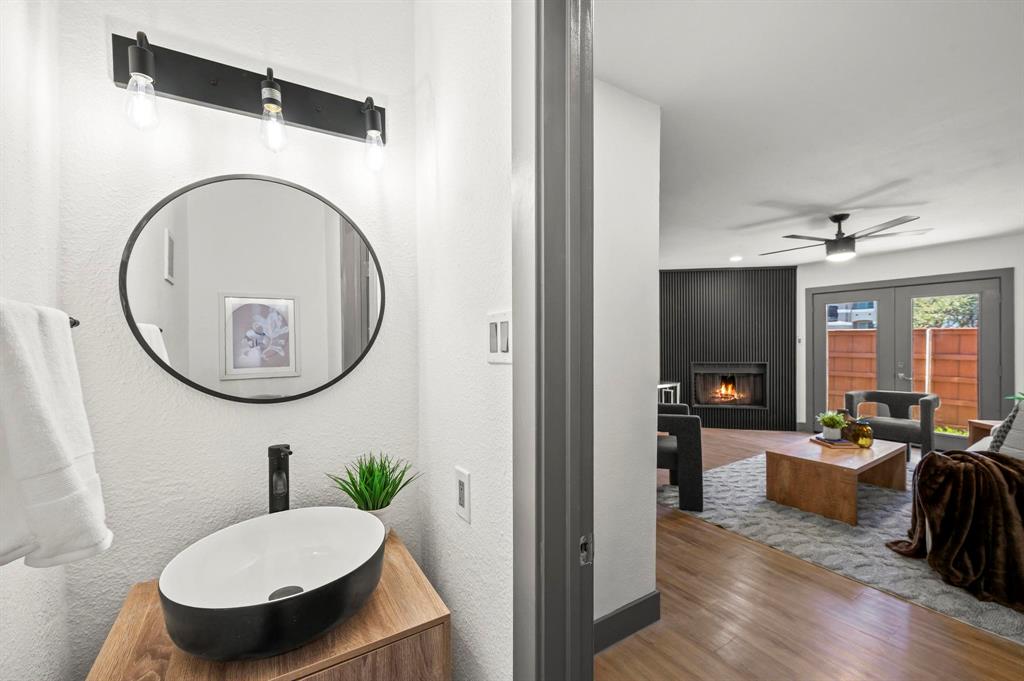 4247 Madera Road Irving, TX 75038 - Photo 6 of 28 a living room with furniture a rug and a mirror