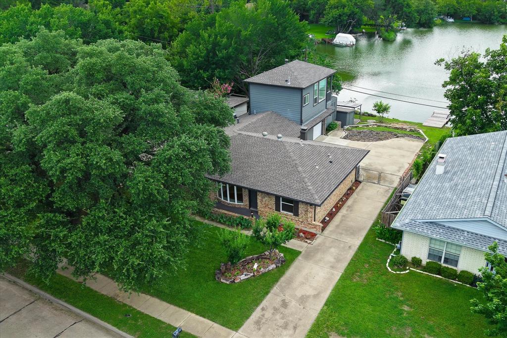 2001 Pebblebrook Trail Irving, TX 75060 - Photo 36 of 40 View of front of home, driveway, and view of lake.